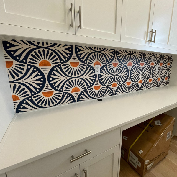 Decorative wallpaper backsplash installation detail