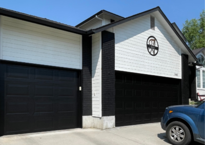 Garage exterior with newly painted door and walls