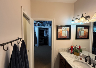 Bathroom with neutral painted walls and lighting