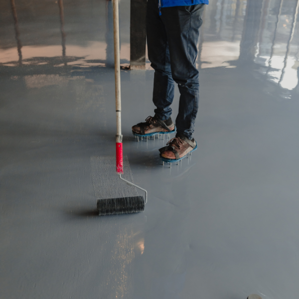 Epoxy floor coating application in progress
