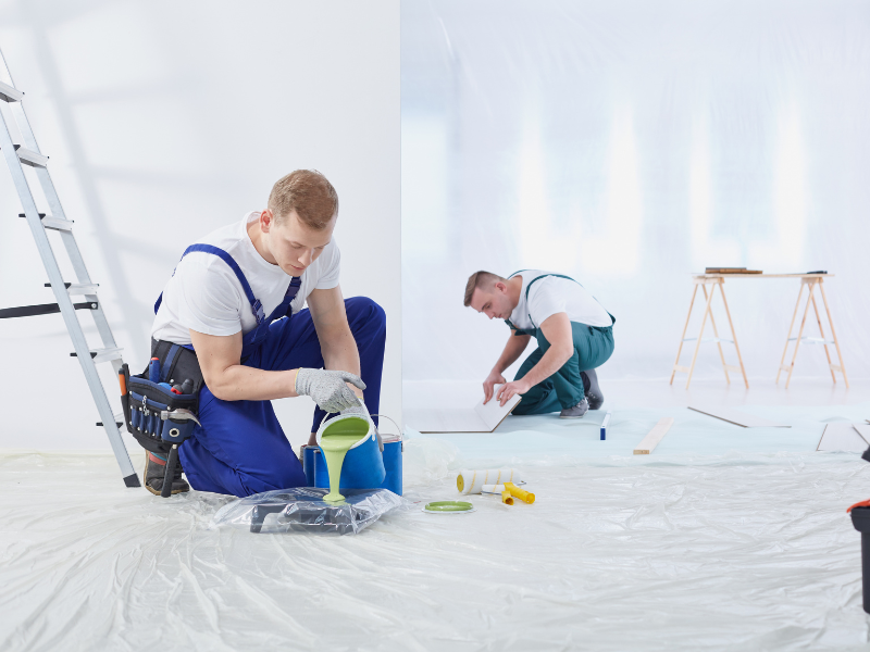 Painter preparing surface with tools before painting