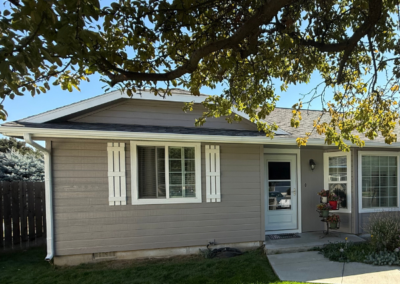 Single-story home with clean siding repaint