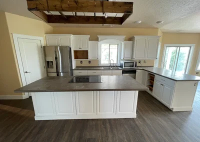 White kitchen cabinets with updated finish