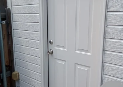 Exterior utility door with painted surface and clean finish