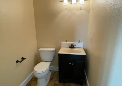 Small bathroom with painted walls and compact vanity