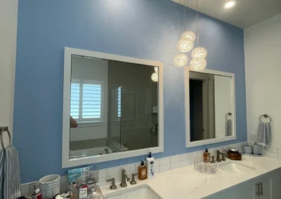 Bathroom vanity with mirror and clean wall paint finish