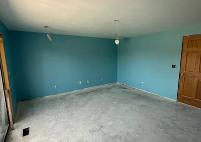 Empty room with blue painted walls and carpet flooring
