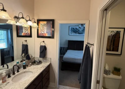 Bathroom interior with dual vanity and mirror lighting