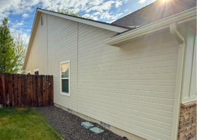 Exterior siding with fence line and fresh paint