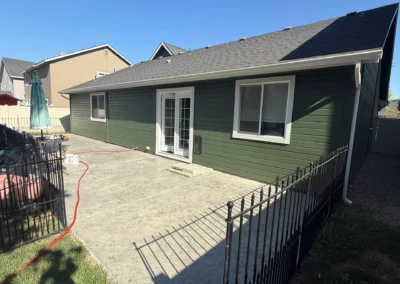 Backyard exterior with painted fence and house